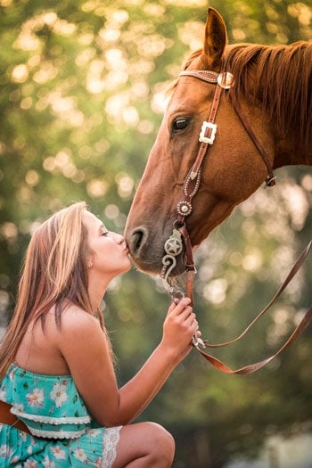 While doing a senior picture shoot last month (which was filmed for my "Photography Start" class), the model mentioned she had horses. OBVIOUSLY the shoot suddenly included the horses because they are an interesting subject. I wanted to take a photo showing how much the girl loves her horse, so I focused in on the fine detail of just part of the horse to capture this shot.